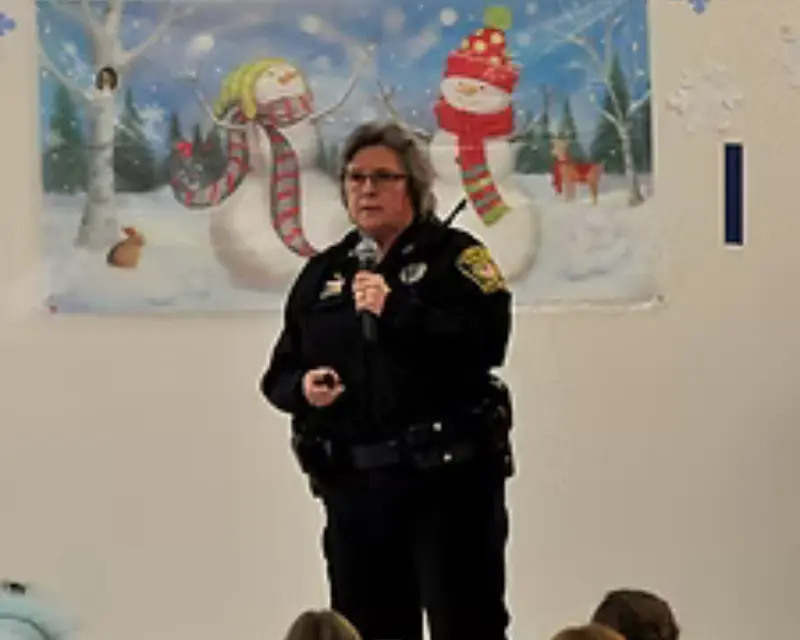 Officer Diane Brand Speaking on a microphone